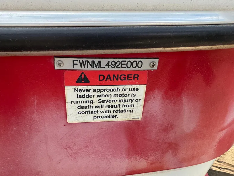 Slide: The Image of 2000 Four Winns 180 Horizon boat on trailer in indoor storage. - 5