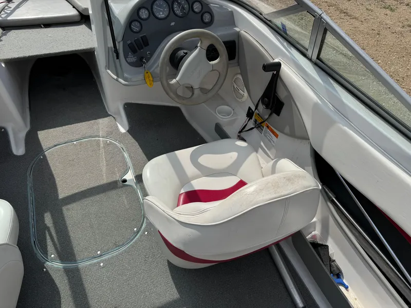Slide: The Image of Steering wheel and dashboard of 2000 Four Winns 180 Horizon boat. - 7