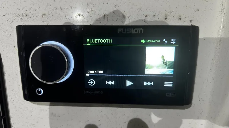 Slide: The Image of Fusion Bluetooth audio system in 2024 Carrera Powerboats 320CC Classic. - 16