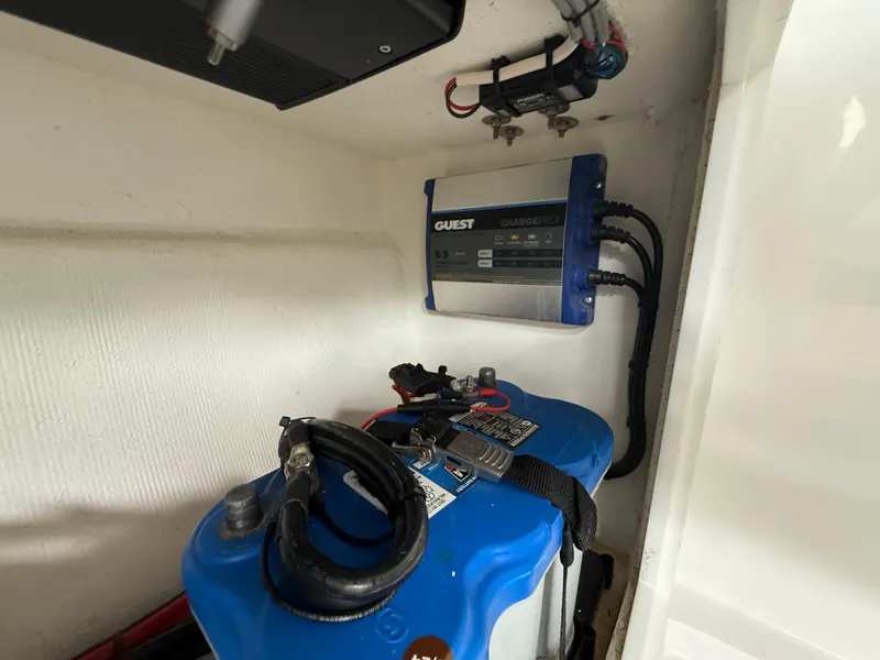 Slide: The Image of Battery and charger setup in 2024 Carrera Powerboats 320CC Classic. - 26