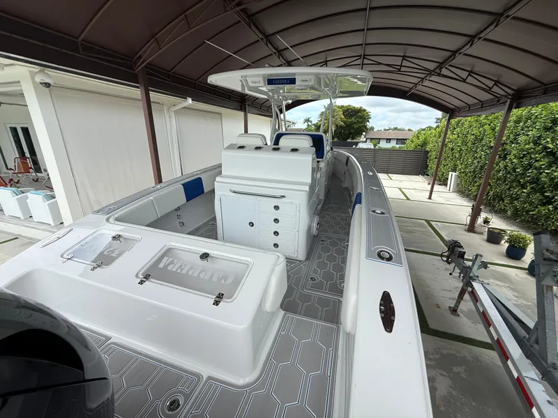 Slide: The Image of 2024 Carrera Powerboats 320CC Classic under a canopy, showcasing sleek design and modern features. - 3