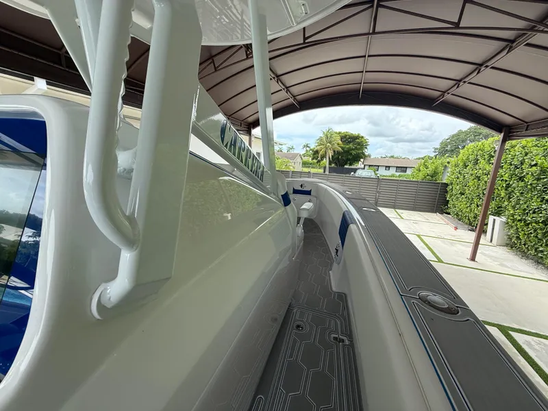Slide: The Image of 2024 Carrera Powerboats 320CC Classic under a canopy, showcasing sleek design and modern features. - 31