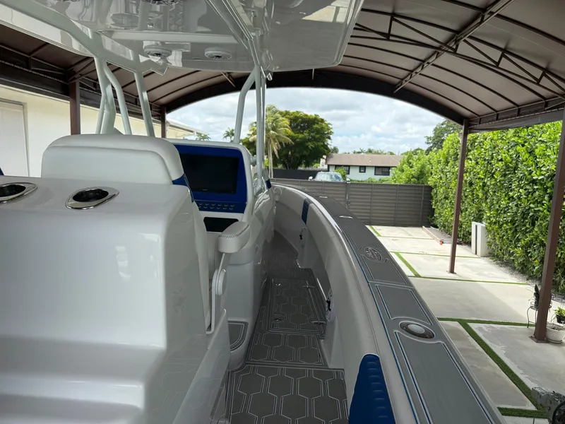 Slide: The Image of 2024 Carrera Powerboats 320CC Classic under a canopy, showcasing sleek design and modern features. - 35