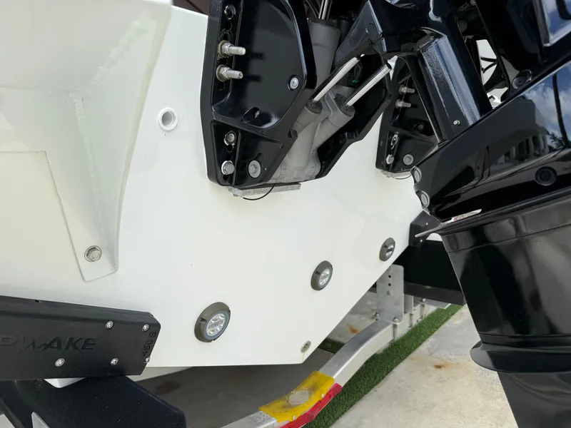 Slide: The Image of 2024 Carrera Powerboats 320CC Classic, close-up of engine mount and hull details. - 39