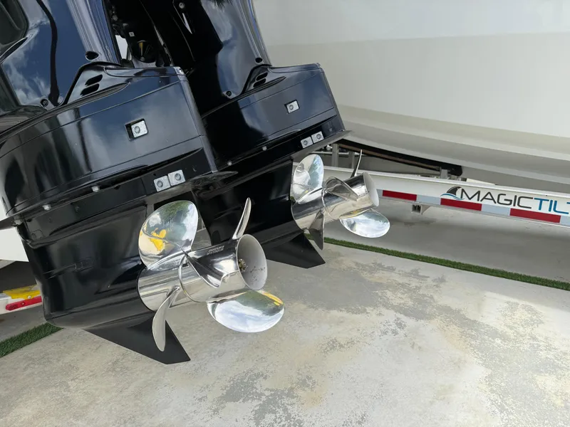 Slide: The Image of 2024 Carrera Powerboats 320CC Classic dual outboard motors with stainless steel propellers. - 40