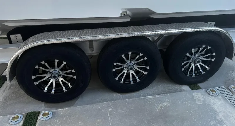 Slide: The Image of Trailer wheels of a 2024 Carrera Powerboats 320CC Classic. - 46