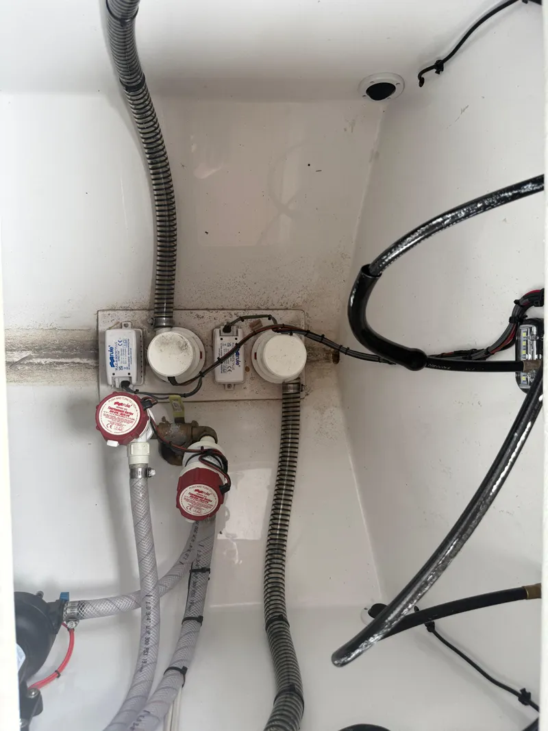 Slide: The Image of 2024 Carrera Powerboats 320CC Classic bilge area with hoses and wiring. - 8