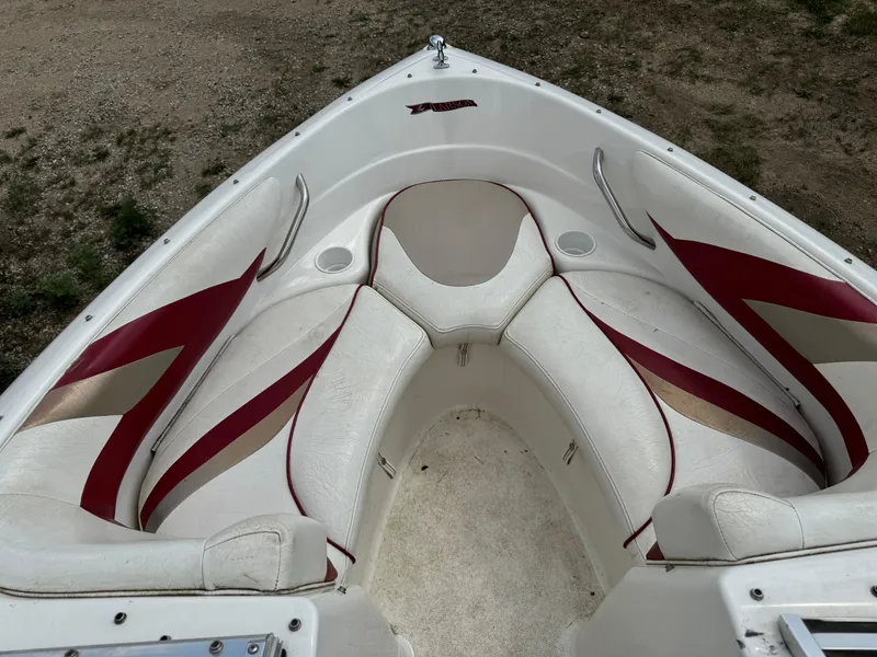 Slide: The Image of Steering wheel and dashboard of a 1998 Larson 195 boat with gauges and Lowrance device. - 7