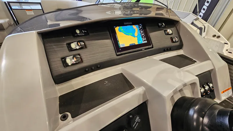 Slide: The Image of Dashboard of a 2020 Bennington L 25 Swingback boat with navigation display. - 13