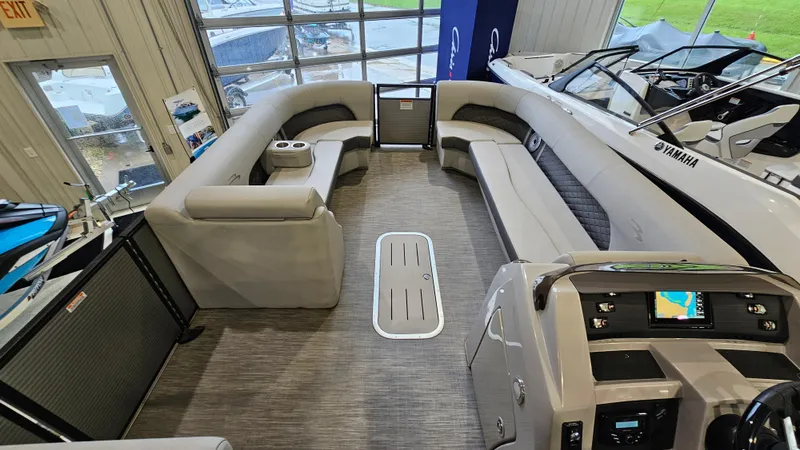 Slide: The Image of 2020 Bennington L 25 Swingback interior with spacious seating and modern dashboard. - 14