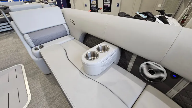 Slide: The Image of 2020 Bennington L 25 Swingback boat interior with gray seating and cup holders. - 17