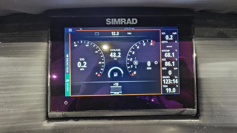 Slide: The Image of Simrad display on 2020 Bennington L 25 Swingback showing speed, fuel, and engine data. - 19