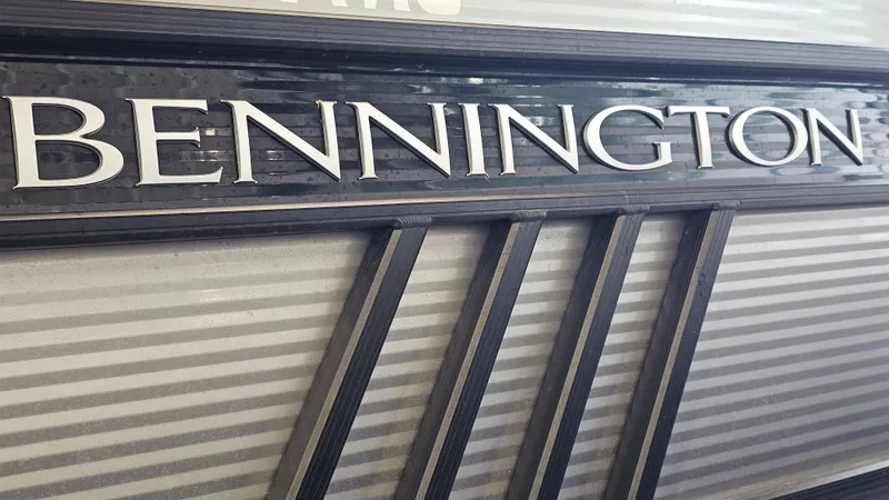 Slide: The Image of Bennington L 25 Swingback 2020 logo on a sleek, modern boat design. - 23