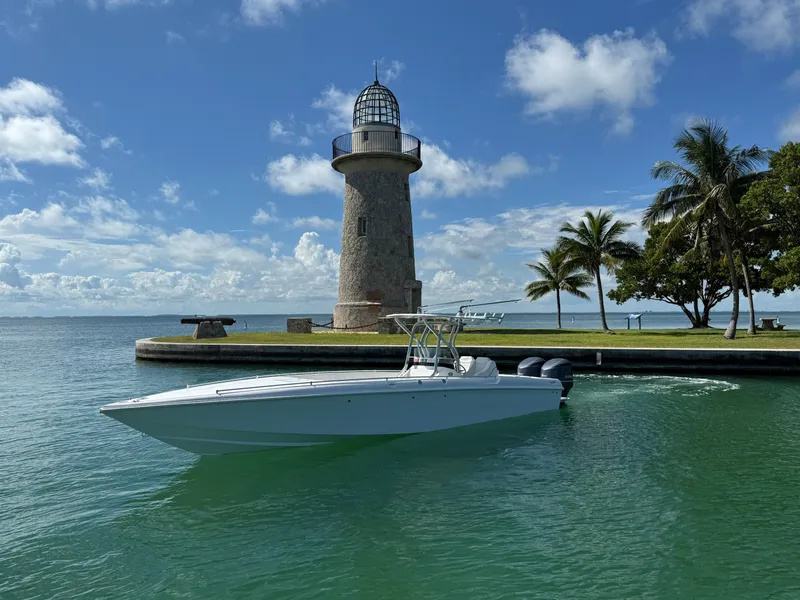 Slide: The Image of 2021 Avance 33 Cabriolet boat near lighthouse and palm trees on a sunny day. - 4