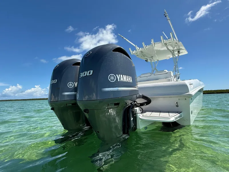 Slide: The Image of 2021 Avance 33 Cabriolet with twin Yamaha 300 engines in clear blue water. - 6