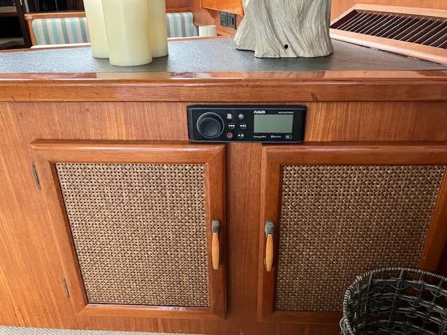 Slide: The Image of 1983 Viking Convertible interior with wood cabinetry and woven panel doors. - 10