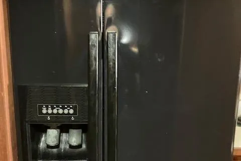 Slide: The Image of 1983 Viking Convertible refrigerator with dual doors and built-in ice dispenser. - 33