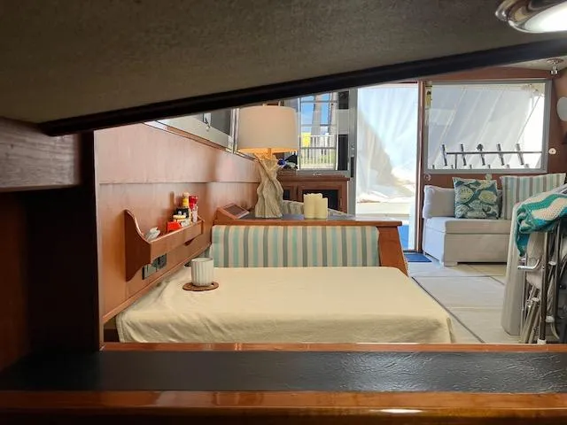 Slide: The Image of Interior of a 1983 Viking Convertible yacht with cozy seating and nautical decor. - 34