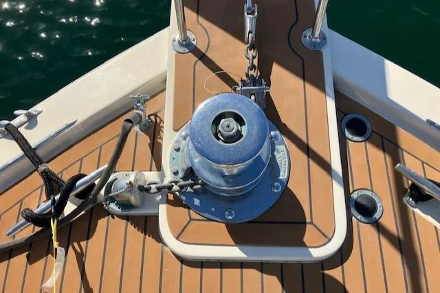 Slide: The Image of Bow of 1983 Viking Convertible boat with anchor winch and teak deck. - 45