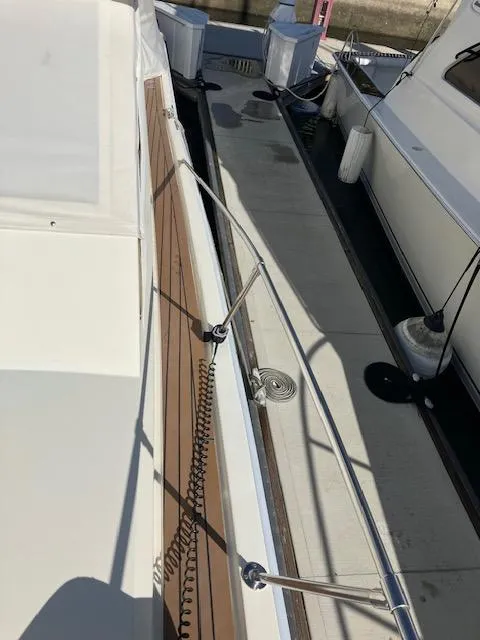 Slide: The Image of 1983 Viking Convertible yacht deck with railing and wooden accents. - 49