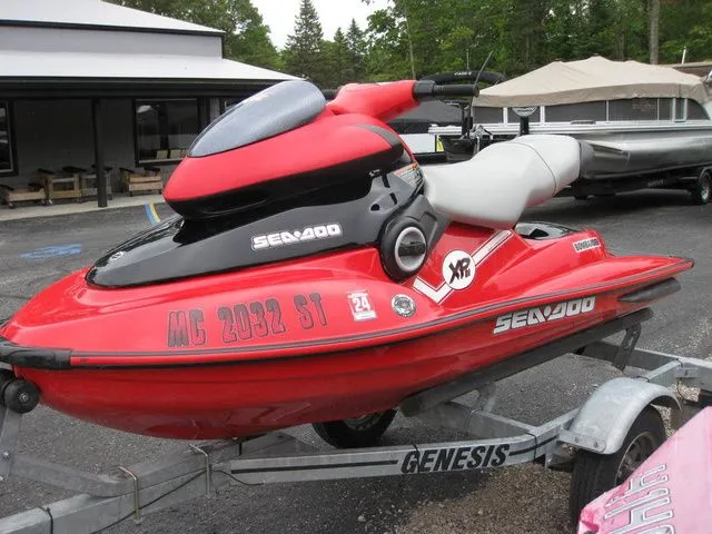 The Image of Red 2004 Sea-Doo XP® DI DI jet ski on trailer. - 1