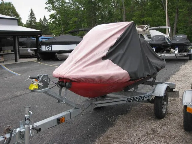Slide: The Image of 2004 Sea-Doo XP® DI DI on trailer with cover. - 7