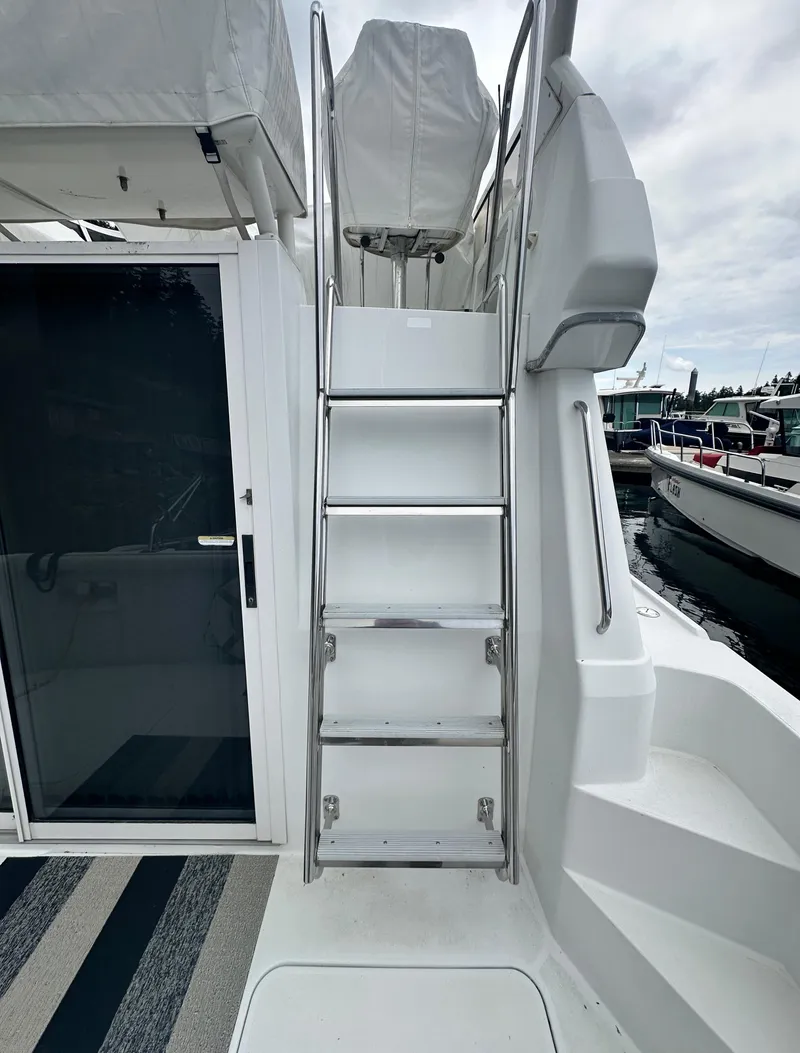 Slide: The Image of Stainless steel ladder on 2000 Carver 374 Voyager yacht, leading to upper deck. - 10