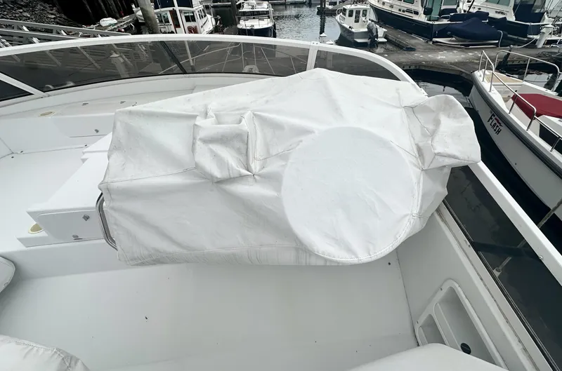 Slide: The Image of Covered helm station on a 2000 Carver 374 Voyager yacht at a marina. - 18