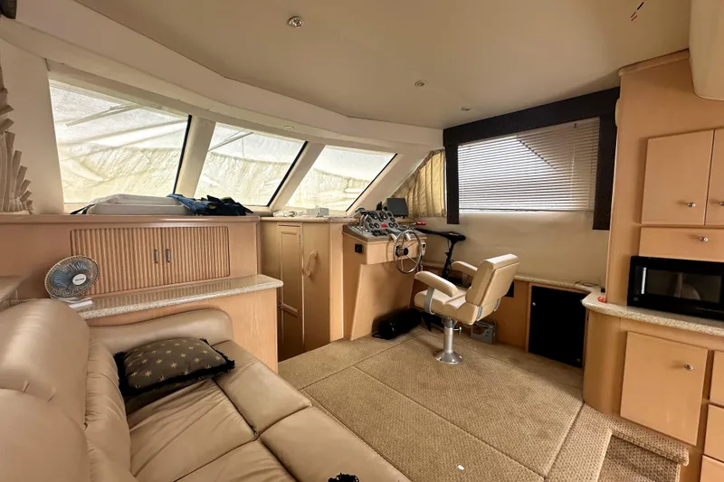 Slide: The Image of Interior of 2000 Carver 374 Voyager yacht with helm, seating, and modern amenities. - 39