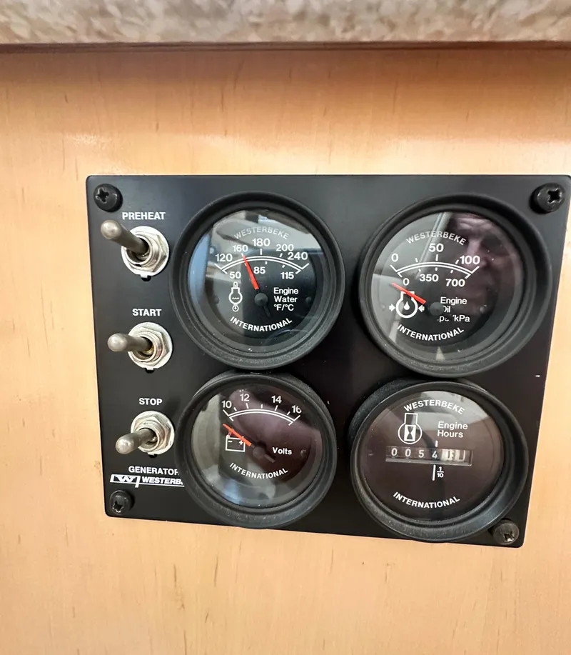 Slide: The Image of Control panel of a 2000 Carver 374 Voyager with Westerbeke gauges and switches. - 44