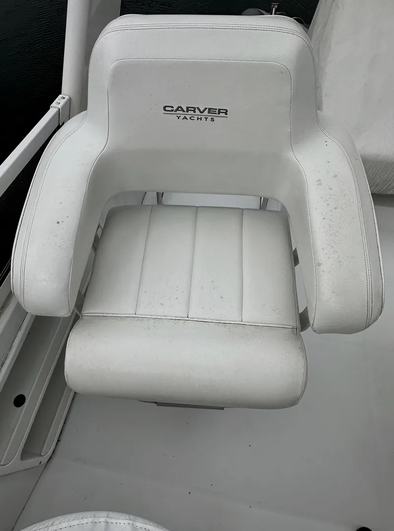 Slide: The Image of White captain's chair on 2000 Carver 374 Voyager yacht deck. - 24