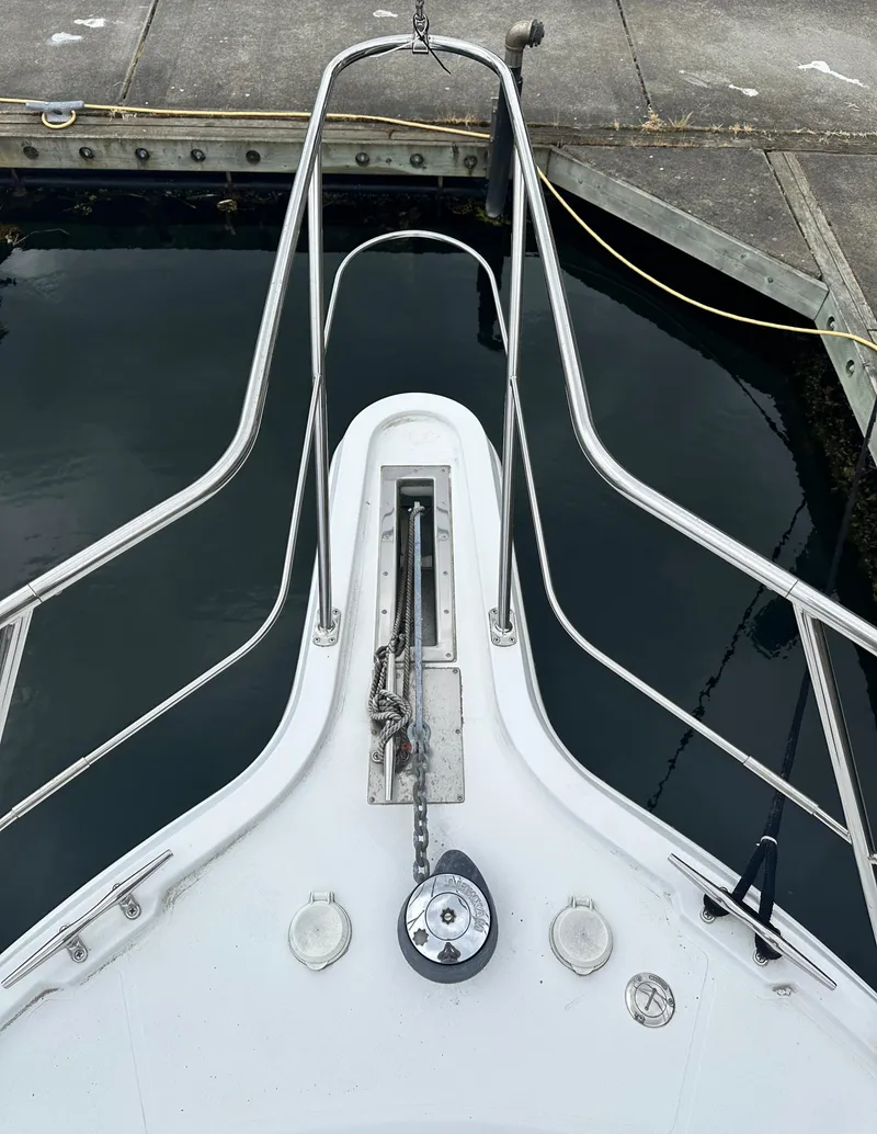 Slide: The Image of Bow of 2000 Carver 374 Voyager yacht docked at marina. - 3