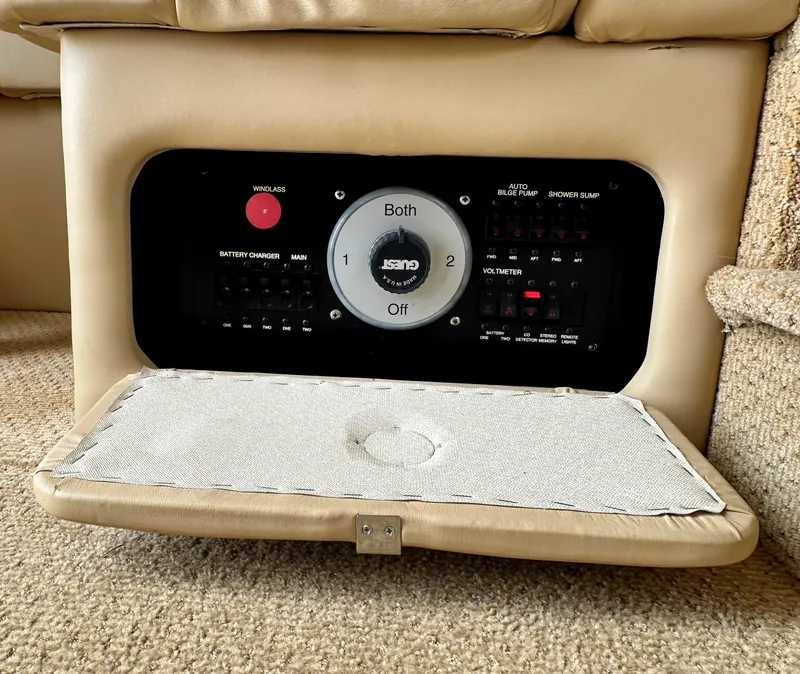 Slide: The Image of Control panel of a 2000 Carver 374 Voyager yacht, featuring battery and system switches. - 46