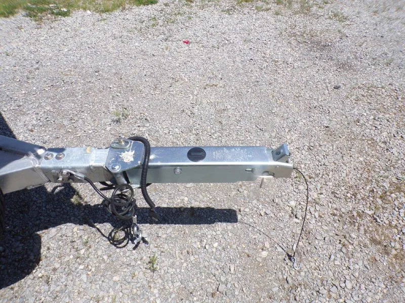 Slide: The Image of Trailer hitch of 2026 Xpress SW20BAY on gravel surface. - 13