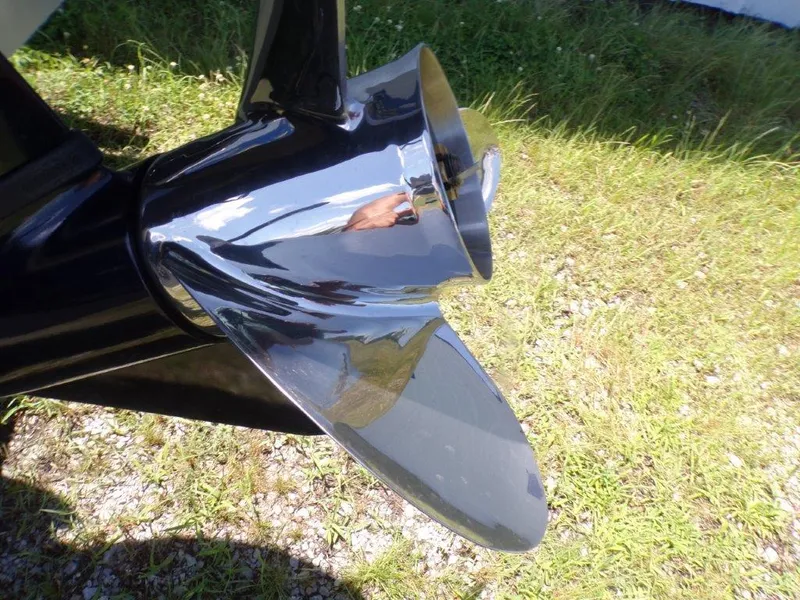 Slide: The Image of Shiny propeller of 2026 Xpress SW20BAY boat on grassy surface. - 5