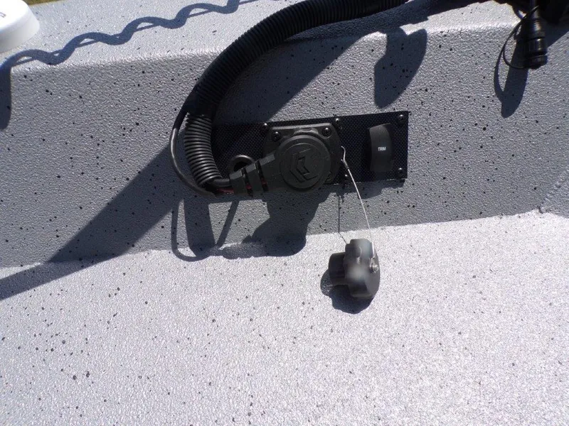 Slide: The Image of 2026 Xpress SW20BAY boat detail showing electrical connection on textured surface. - 7