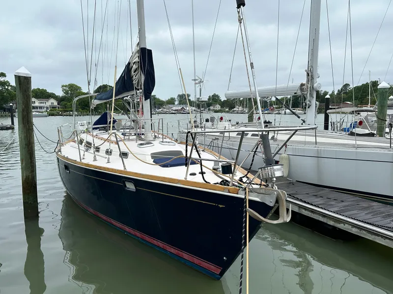 Slide: The Image of Sailing yacht Sabre SABRE 425, 1994 model, docked at marina with overcast sky. - 11