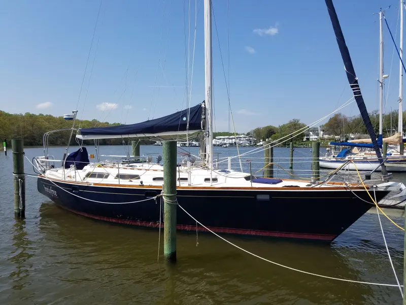 Slide: The Image of Sailing yacht Sabre 425, 1994 model, docked on a sunny day by the river. - 2