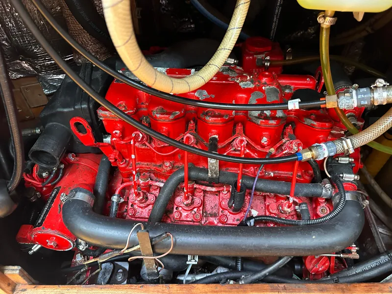 Slide: The Image of Red engine of a 1994 Sabre SABRE 425 with visible hoses and components. - 22