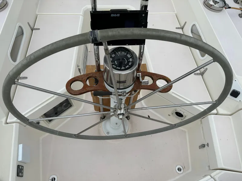 Slide: The Image of Steering wheel and compass on 1994 Sabre SABRE 425 sailboat cockpit. - 23