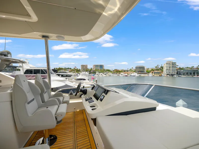 Slide: The Image of Luxurious 2024 Absolute 60 Fly Co Ownership yacht interior with marina view. - 18