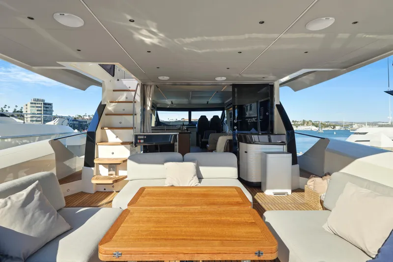 Slide: The Image of Luxurious 2024 Absolute 60 Fly yacht interior with elegant seating and wooden table. - 21