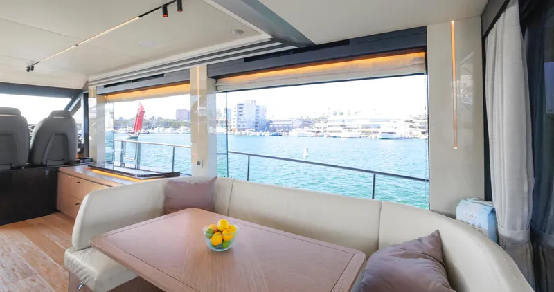 Slide: The Image of Luxurious interior of 2024 Absolute 60 Fly Co Ownership yacht with waterfront view. - 25