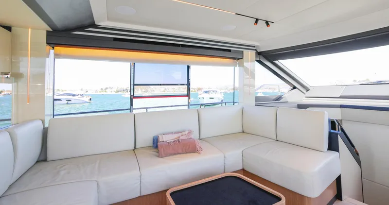 Slide: The Image of Luxurious interior of 2024 Absolute 60 Fly Co Ownership yacht with white seating and ocean view. - 27