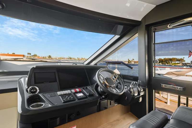 Slide: The Image of Interior view of 2024 Absolute 60 Fly Co Ownership yacht cockpit with modern controls. - 30