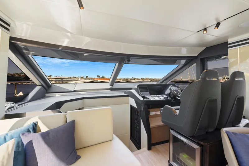 Slide: The Image of Interior view of 2024 Absolute 60 Fly Co Ownership yacht cockpit with modern seating and controls. - 31