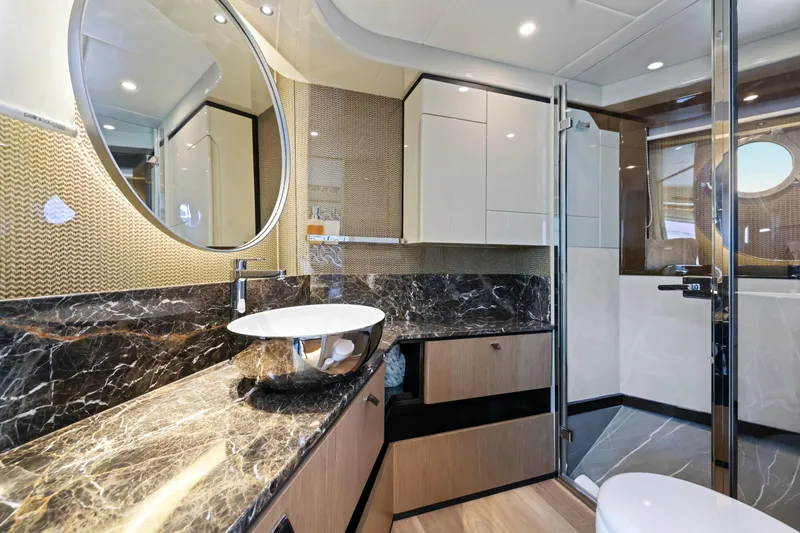 Slide: The Image of Luxurious bathroom in 2024 Absolute 60 Fly Co Ownership yacht, featuring modern fixtures and elegant design. - 37