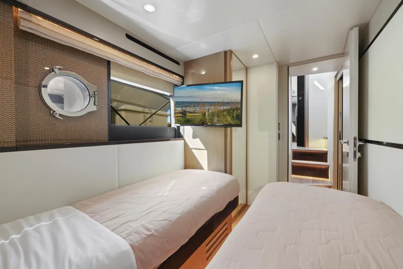 Slide: The Image of Luxurious cabin interior of 2024 Absolute 60 Fly Co Ownership yacht with twin beds. - 49