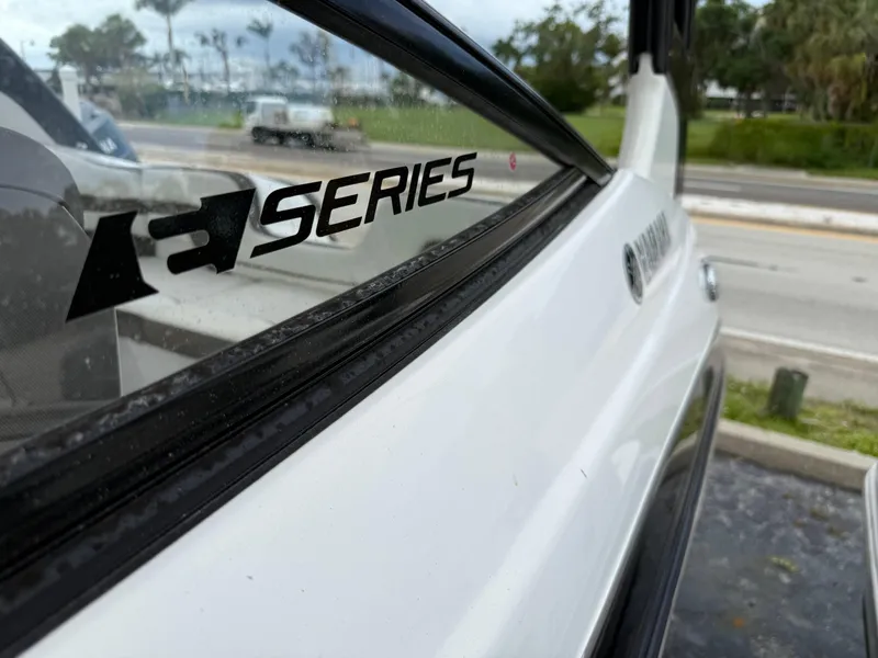 Slide: The Image of 2016 Yamaha Boats 242 Limited S E-Series, close-up of logo and exterior design. - 11