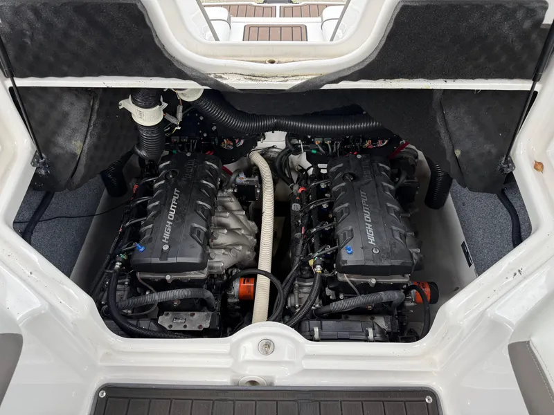 Slide: The Image of Engine compartment of a 2016 Yamaha Boats 242 Limited S E-Series, showcasing dual engines. - 17
